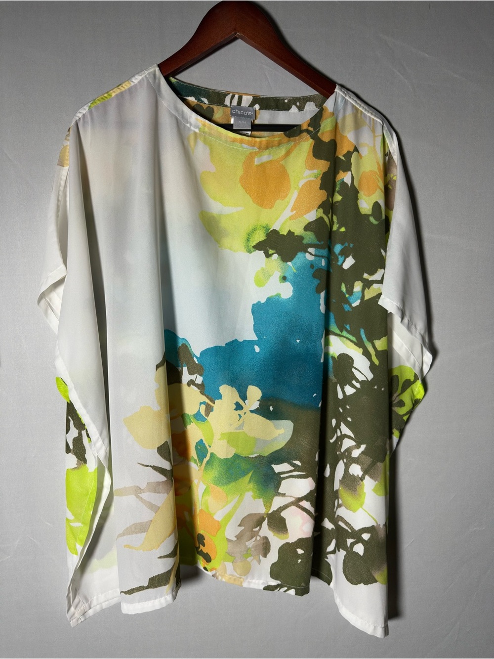 Chico's flowy soft poncho top.  Vibrant watercolor floral print on white base.